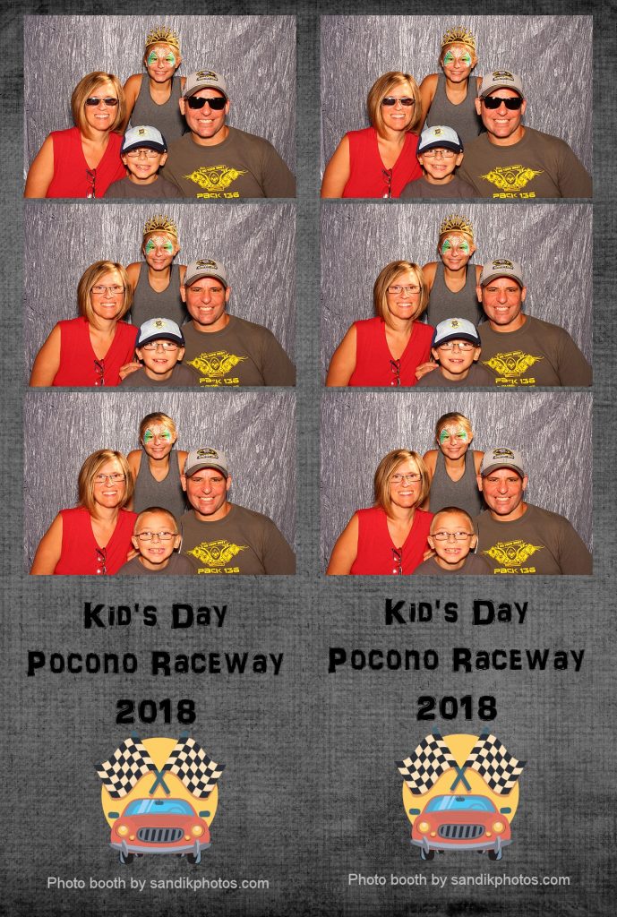 family having fun in a photo booth