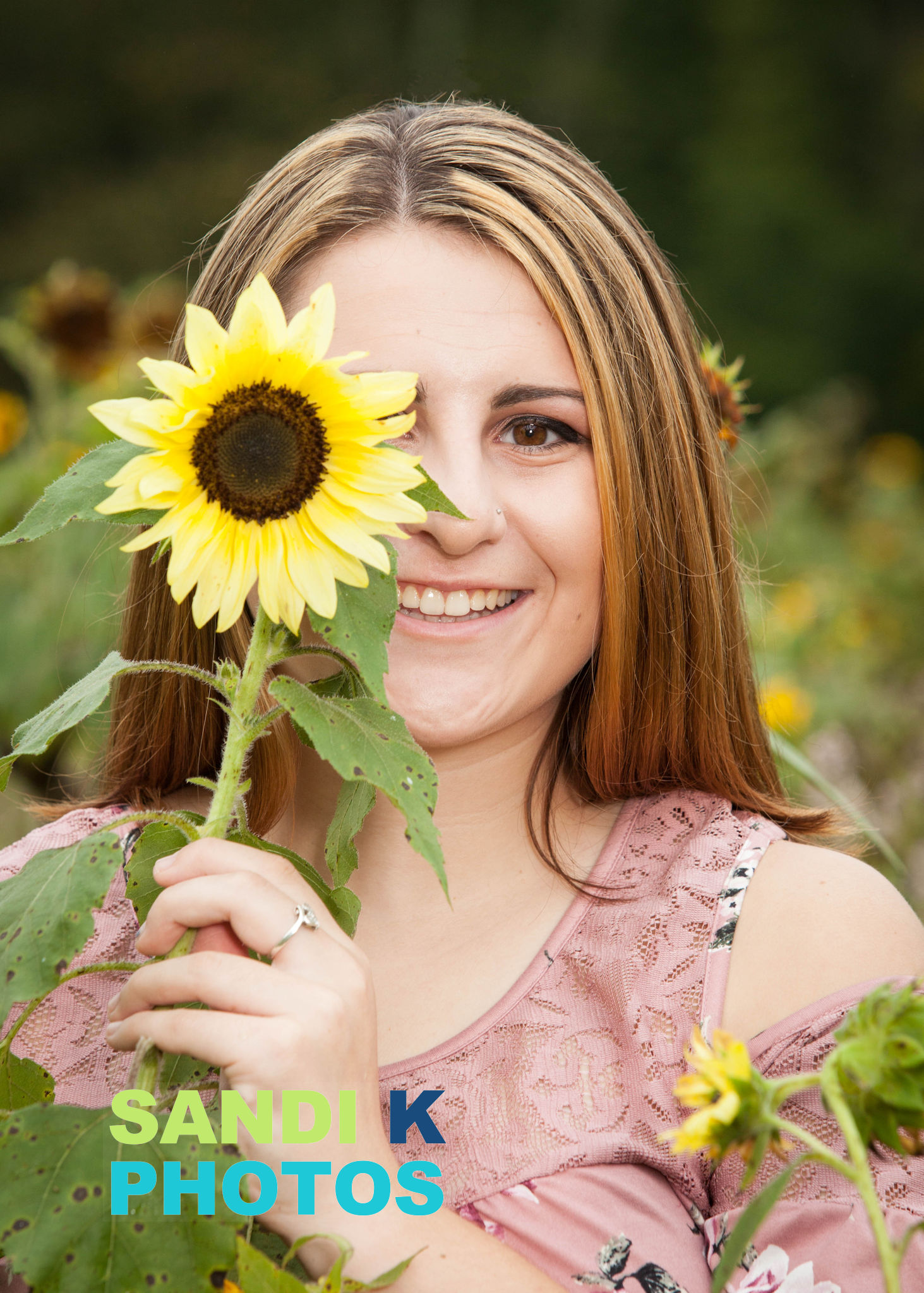 senior picture with sunflower